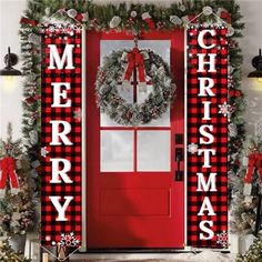 a red door decorated with christmas decorations and wreaths