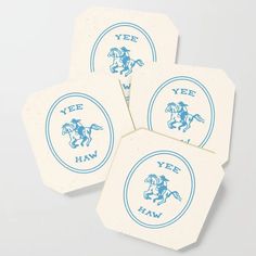 four coasters with the words yee hah and a blue horse on them