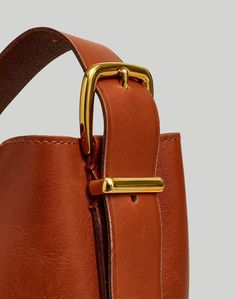 Our newest leather bag collection is cool, modern and quietly luxe. With a magnetic closure and interior pocket, the bucket tote is perfectly sized to hold up to a 15" laptop, water bottle, phone, wallet, keys and more—plus, it has an adjustable shoulder strap. It's so good, it's Essential.Leather.Magnetic closure.Interior pocket.11" (at shortest) to 13" (at longest) handle drop.14"H x 10"W x 6"D.Imported.Select stores. Madewell Bags, Bucket Tote, Bags Leather Handbags, Bag Collection, Bags Tote, Phone Wallet, Waxed Cotton, Long Handles, Womens Tote Bags