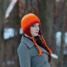 This warm orange hat is one of a kind. It has been crochet with two strands of yarn. This ensures that it is super thick and warm. It fades gracefully from bright orange to darker rusted oranges. It has triangular ear flaps with tie-able tassels. One size fits most. Hand wash and lay flat to dry. Yarn may vary slightly from photo. Wear it and make a statement! Great for supporting your favorite cozy season! It is double threaded and super warm. It has a lot of charm and spunk. Great for back to Orange Hat, Flap Hat, Ear Flap Hats, Orange Hats, Cozy Season, Trapper Hats, Winter Beanie, Perfect Gift For Him, Beautiful Hats