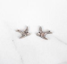 Give the perfect boho gift with these trendy sterling silver bird stud earrings. Made with .960 sterling silver for the birds and .925 sterling silver for the posts and backs, these lightweight earrings are minimal and stylish. The patina finish adds an antique touch, giving them a unique boho feel.  Please note that it may take up to 1-2 weeks for these earrings to ship due to the manufacturing process. Nickel Free Sterling Silver Jewelry In Bird Shape, Silver Jewelry With Bird Design, Silver Bird Shaped Jewelry For Gifts, Nickel-free Bird-shaped Earrings For Gifts, Silver Bird-shaped Earrings For Pierced Ears, Silver Bird-shaped Earrings For Gift, Silver Bird-shaped Earrings Gift, Silver Bird-shaped Sterling Silver Necklace, Boho Gifts