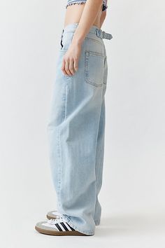 The ultimate pair of boyfriend jeans from BDG and only at Urban Outfitters. BDG Logan buckle baggy boyfriend jeans in a wardrobe-essential mid rise. Boyfriend fit buckle jeans with a baggy wide leg and buckle detail at the back for a cinchable waistband. Finished with light distressing at the hem for an effortlessly lived-in look. Features BDG Logan buckle baggy boyfriend jeans BDG baggy jeans with a cinchable waistband and stitched detailing at the knees Crafted from rigid BDG denim that will soften more and more over time Our favorite slouchy mid rise in a baggy fit Full length that hits below the ankle Zip fly + 5-pocket styling UO exclusive Content + Care 100% Cotton Machine wash Imported Size + Fit Mid rise Wide leg Full length Model in Red is 5'10" and wearing size 27 Measurements ta Everyday Baggy Rigid Denim Bottoms, Oversized High Rise Jeans For Everyday, Oversized High-rise Jeans For Everyday, High Rise Oversized Jeans For Everyday, Oversized Straight Leg Rigid Denim Bottoms, Baggy Tapered Leg Jeans For Everyday, Loose Fit Medium Wash Jeans For Everyday, Oversized Medium Wash Jeans For Everyday, Oversized Everyday Jeans For Spring