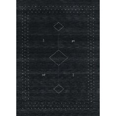 a black rug with white dots and squares on the bottom, in front of a dark background