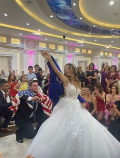 a bride and groom dancing in front of an audience