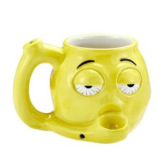 a yellow coffee mug with eyes and nose