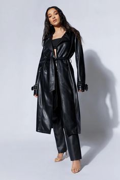 Isla Pu Trench - Black- MESHKI U.S Belted Fitted Long Outerwear, Belted Long Fitted Outerwear, Chic Fitted Long Outerwear, Fitted Belted Notch Lapel Outerwear, Sleek Notch Lapel Outerwear For Fall, Fitted Long Outerwear For Work, Sleek Long Coat For Workwear, Sleek Long Coat For Work, Black Long Belted Outerwear