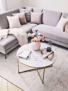 a living room filled with furniture and pillows