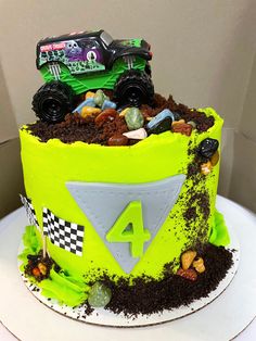 a monster truck birthday cake with dirt and rocks