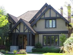 a house with brown trim and black windows