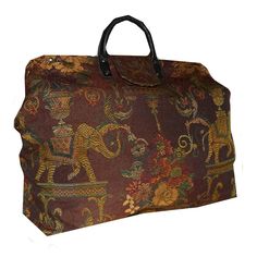 SIZE: 18 x 15 x 7 inches These elephants will carry more than vases. Gold, red & green on a burgundy background woven tapestry fabric. Ready to ship in 5-7 business days. The tapestry fabric covers a spring-loaded steel frame which snaps open for easy access. A magnetized fabric flap closure adds the finishing touch. Bags are fully lined. At the bottom of each you'll find a lightweight board, providing stability between the fabric layers. Each bag sits on six brass feet to protect the fabric whe Burgundy Weave, Jacobean Floral, Red Forest, Overnight Travel Bag, Woven Tapestry, Carpet Bag, Tapestry Fabric, Artisan Gift, Overnight Bags