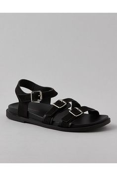 Vegan leather upper/Open toe/Triple strap design with adjustable buckle closures/Rubber outsole Modern Flat Footbed Sandals With Buckle Closure, Flat T-strap Sandals With Buckle Closure, Adjustable Flat T-strap Sandals With Buckle Closure, Adjustable Round Toe Sandals With Buckle Closure, Modern T-strap Sandals With Buckle Closure And Round Toe, Flat Synthetic Sandals With Buckle Closure, Flat Sandals With Buckle Closure In Synthetic Material, Modern T-strap Sandals With Buckle And Ankle Strap, Modern T-strap Sandals With Ankle Strap