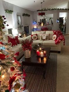 a living room filled with furniture and christmas decorations