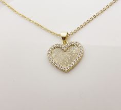 "ACTUAL FINGERPRINT &HANDWRITING HEART-SHARP NECKLACE This necklace is personalized with actual fingerprint and handwriting you provide us.It is good for Anniversary ,Birthday or Wedding gift. I T E M ∙ D E T A I L S 1. M A T E R I A L S   GOLD-FILLED (hypoallergenic)    -14K Gold fill is a pressure-bonded layer of gold that has 100 times more gold than plated jewelry. It is durable, won't chip or flake, is tarnish-resistant, and is a great alternative to \"karat\" gold that is reasonably priced Handwriting Necklace Custom, Fingerprint Necklace, Handwriting Necklace, Gift For Anniversary, Necklace Heart, Necklace Personalized, Birthstone Necklace, Memorial Gifts, Wedding Necklace