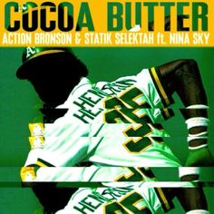 a baseball player holding a bat on top of a green cover with the words cocoa butter