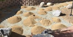 an outdoor area with rocks and gravel on the ground