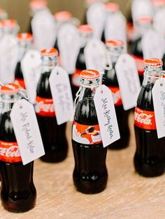 there are many soda bottles with labels on them