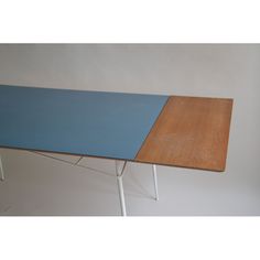 a wooden table with two different colors on it