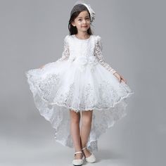 This White Full Lace Design Long Back Trail Princess Party Dress is the perfect choice for your little princess. She will feel very comfortable in this charming and elegant party dress. The design of a full lace bodice makes your girl look so beautiful, stunning, and graceful!Features: Full lace design. Full sleeve design. Knee-length dresses. Crew neck design. Comfortable to wear. Bow design. Formal style. Fabric & Care: Made of high-quality cotton fabric, polyester, and voile. Machine washed p Kids Evening Gowns, Lace Dress For Kids, Princess Party Dress, Full Sleeves Design, Wedding Dresses For Kids, Red Bridesmaid Dresses, Elegant Party Dresses, Flower Girl Dress Lace, White Lace Dress