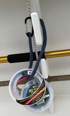 several different types of fishing tape hanging on a hook