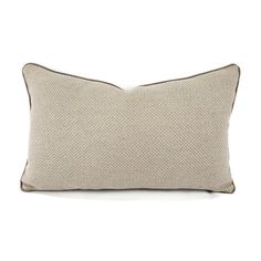 a beige pillow with brown piping on the front and back, sitting against a white background