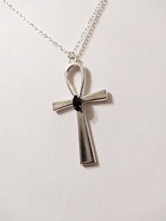 "◆ Pendant with Ankh cross The pendant measures 2.16535 x 1.1811 inches and it is silver plated, a beautiful black teardrop crystal is set in the center. the size of the chain is adjustable but for any need you can contact me :) The product is handmade with great care. ♡ In my shop there are many handmade jewels for all tastes, come and look at them you are welcome! ♡ -------------------------------------------------------------------------- The Ankh cross is perfect to wear around the neck and Adjustable Silver Ankh Necklace, Gothic Silver Teardrop Jewelry, Gothic Teardrop Silver Jewelry, Silver Ankh Cross Spiritual Necklace, Silver Ankh Cross Necklace Spiritual Style, Silver Ankh Cross Necklace In Spiritual Style, Black Ankh Jewelry For Gifts, Black Ankh Metal Jewelry, Ankh Shaped Black Metal Necklace