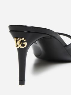 Dolce & Gabbana's black patent leather sandals featuring a round toe, front strap, leather lining, insole and sole and stiletto heel with gold-tone metal DG logo plaque on the back. Composition: 100% calfskin Dg Logo, Feminine Chic, Stefano Gabbana, Pendant Rings, Italian Style, Black Patent Leather, Stiletto Heel, Luxury Shoes, Gold Tone Metal