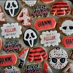 decorated cookies are arranged in the shape of numbers and characters for a halloween themed party