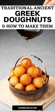 a bowl filled with fried doughnuts on top of a wooden cutting board