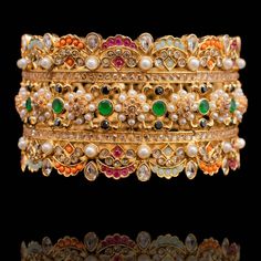 The perfect pick for your celebratory closet! Crafted with precision, presenting our Geenah Bangle with nakshi work intricately embellished with regal rows of stones. Available in various sizes. Gold-plated on high-quality brass as base metal. Size 2.8 is in-stock & ready-to-ship. The delivery time frame for Size 2.4 & 2.6 is 4-6 weeks. For custom or urgent requests, please contact support@alacouture.com. *Please Note: We use faux stones and beads in all of our jewelry. Faux Stone, Base Metal, Gold Plate, Crown Jewelry, Bangles, Size 2, Plating, Brass, Beads