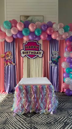 a birthday party with balloons and decorations