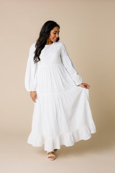 Beautifully embroidered midi on a comfy loose fitting dress Lightweight woven gauzy fabric Round neckline Long embroidered bishop sleeve Side pockets Fully lined Fabric content - Cotton - Dry clean only Embroidered White Dress, Lds Temple Dress, Temple Dresses, Getaway Dress, Called To Surf, Temple Dress, Occasion Dresses Wedding, Fitting Dress, Loose Fitting Dresses