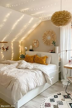 a bed room with a neatly made bed and lots of lights