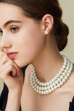 This sumptuous piece of jewelry features a retro-elegant yet slightly modern style that complements the lavish garments, reminiscent of the roaring 1920s. Features: Lustrous imitation pearls Three strand design 16.9 inch / 43cm, 18.1 inch / 46cm, 19.7 inch / 50cm long 6mm, 8mm, 10mm pearls Evening Pearl Necklace With Round Beads, Evening Round Pearl Drop Necklace, Evening Pearl Drop Necklace, Classic Pearl Necklace With Pearl Chain For Parties, Elegant Jewelry With Round Beads For Evening, Elegant Round Beads Jewelry For Evening, Classic Pearl White Pearl Necklace For Party, Classic Round Pearl Necklace For Party, Classic Pearl White Necklace For Party