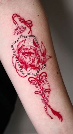 a woman's arm with red ink on it