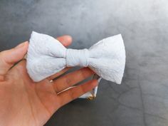 DETAILS: - off white bow tie - Pre tied bow tie - Adjustable length - With elastic band - If you need more quantity, please contact me first! MEASUREMENTS: Length: 11.5 cm (4.53'') Width: 6 cm (2.36'') CLEANING: - We do not recommend washing your bow tie in the washing machine. If your bow tie gets dirty, just dip a white cloth in warm water, squeeze tightly and wipe off the dirt right away.  - In case of extreme dirt stains, we recommend taking your bow tie to the nearest dry cleaning service provider.  ORDERS and SHIPMENT: - All bow ties are carefully packaged in a beautiful gift box to reach you as safe as possible.  - We need 1-3 business days to make the bow tie, before we can ship it out. - We register the packet, so you should personally receive it. - you can also choose EXPRESS SHI White Detachable Bow Tie For Black Tie Events, White Bow Tie For Gifts, White Bow Tie Gift, Formal White Bow Tie With Ribbon, White Bow Tie, Dry Cleaning Services, Diy Wedding Dress, Tie Bow Tie, Dirt Stains