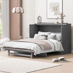 a bed sitting next to a book shelf in a bedroom on top of a hard wood floor