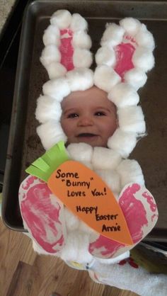 a baby in a bunny costume with some carrots on it's head and the words sorry, i love you happy easter