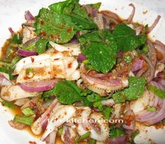 a white plate topped with meat and veggies