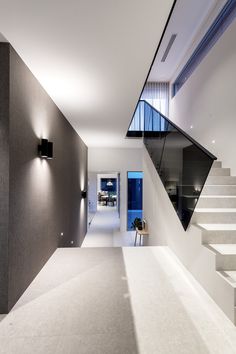 the interior of a modern house with stairs