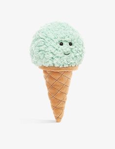 an ice cream cone with a smiling face on it's head, sitting in front of a white background