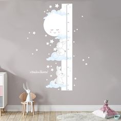 a child's room with a growth chart wall decal