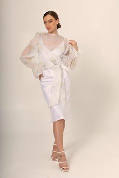 White Organza Dress For Mother Of The Bride, Fitted Wrap Dress For Wedding, White Dress With Sheer Sleeves For Wedding Guest, Feminine Wrap Wedding Dress, Spring Wedding Dresses With Cape Sleeves, Ethereal Wedding Dress With Sheer Sleeves, Delicate Sheer White Dresses, Spring Wedding Night Organza Dress, White Organza Dress With Sheer Sleeves