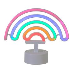 the light up rainbow ring is on top of a white stand with four different colors