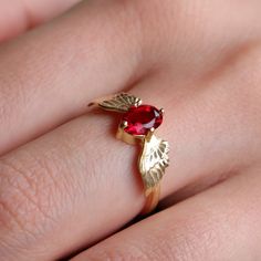 Bohemian Gold Plated Angel Wings Ring, Ruby Ring, Ethnic Ruby Ring, Boho Style Angel Wings Ring, Stunning Gold Retro Angel Wing -->Ring details: - Theme:Romantic Wedding & Engagement - comfortable band - Center Stone : Ruby - Ruby carat: 5*7mm --->Materials: - 925 Silver Gold Plated - 14k rose gold --->The ring size on the model is 4 US. --->Items are shown larger in pictures to show detail - please note the dimensions. This item is in my shop are handcrafted made to order. --->Accessories: - be Bohemian Ruby Ring Jewelry, Angel Wings Ring, Wings Ring, Wing Ring, Angel Wing Ring, Angel Ring, Ruby Ring Vintage, Aesthetic Rings, Ruby Ring Gold