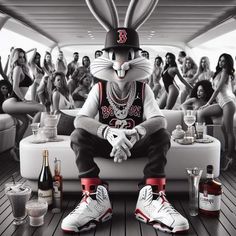 a rabbit sitting on top of a couch next to bottles of alcohol and liquor glasses