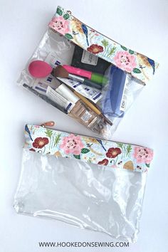 the contents of a makeup bag sitting on top of a white table next to each other