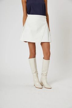 White skirt with wooden buttons and a wrap detail. Longer length. Women's Cream Skirt, Cheap White Skirt With Button Closure, Cheap Beige Skirt With Button Closure, Luxury Off-white Skirt For Spring, Dressing Beige Mini Skirt, Maxi Romper, Wooden Buttons, White Skirt, Leather Mini Skirts