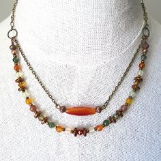 This original necklace is made of two strands: one with small colorful agate beads, crystal faceted beads, hematite and copper beads, and tiny czech glass beads for highlights; the other featuring a delicate orange agate surrounded by two copper beads. The chain is nickel and lead free. With its warm tones, this necklace will make a perfect gift for Christmas. It will come in a fine gift box. The order is dispatched within 72 hours after receipt of payment, in a bubble envelope to protect your j Jewelry 2024, Winter Necklace, Orange Copper, Necklace Orange, Original Necklace, Orange Agate, Double Strand Necklace, Strung Beads, Jade Earrings