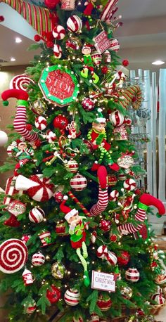 a christmas tree decorated with candy canes and ornaments