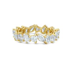 The Fancy Multi Shape Diamond Eternity Band in 18K Gold is a stunning piece of jewelry designed to capture attention and admiration. Crafted with meticulous attention to detail, this eternity band features a dazzling array of diamonds, totaling 3.43 carats, set in lustrous 18K gold. What sets this eternity band apart is its unique design, showcasing a variety of diamond shapes meticulously arranged to create a captivating visual display. The combination of oval, heart shape, marquise, emerald cut and pear shape diamonds adds depth and dimension to the band, creating a dynamic and sophisticated look. Each diamond is carefully selected for its exceptional brilliance, clarity, and color, ensuring that the overall sparkle of the band is nothing short of spectacular. The diamonds are expertly s Blue Sapphire Eternity Band, Sapphire Eternity Band, Marquise Shape Diamond, Sapphire Band, Diamond Eternity Band, Heart Shaped Diamond, Jewelry Lookbook, Pear Shaped Diamond, Eternity Band Diamond